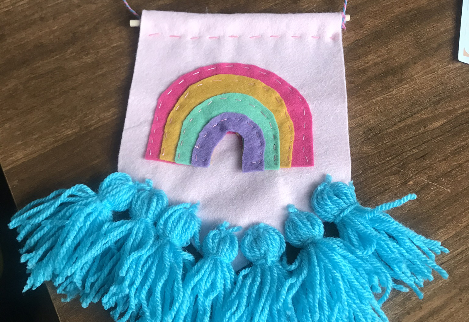 Craft banner with rainbow on it
